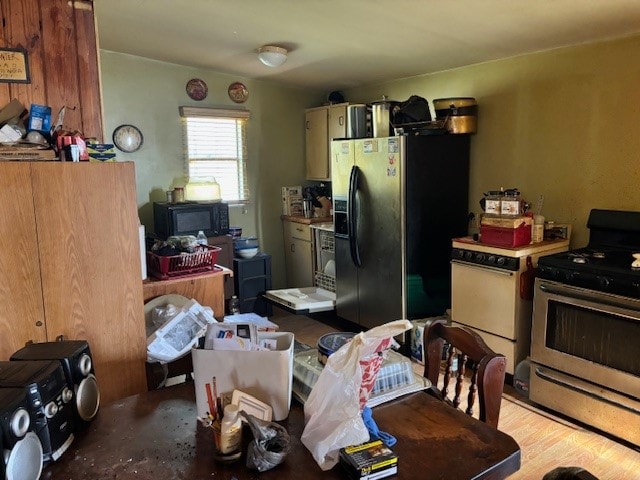 kitchen featuring appliances with stainless steel finishes and light hardwood / wood-style floors