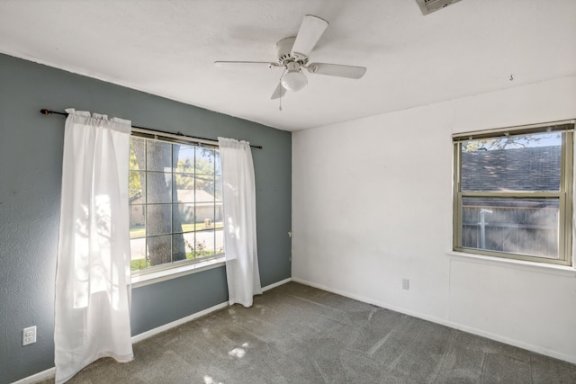 spare room with carpet flooring and ceiling fan