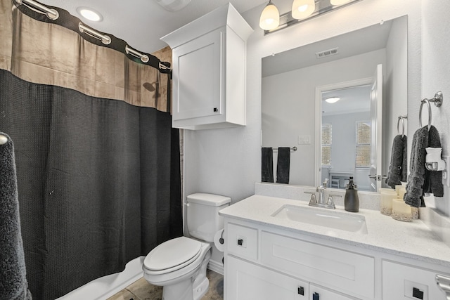 bathroom with tile patterned floors, vanity, and toilet