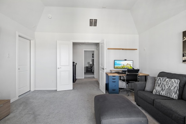 carpeted living room with vaulted ceiling