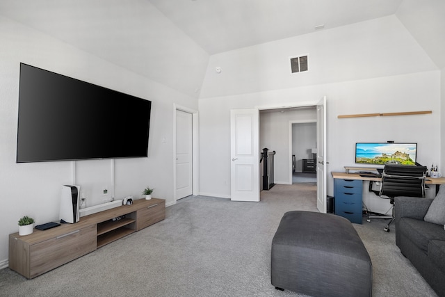 living room with light colored carpet and vaulted ceiling