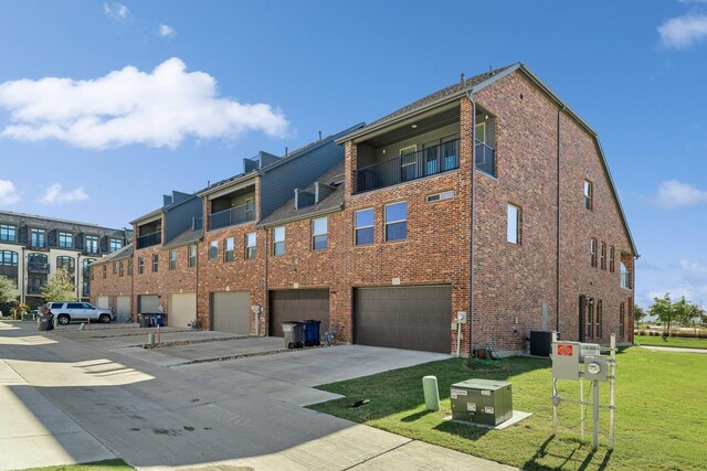 view of property featuring cooling unit and a garage