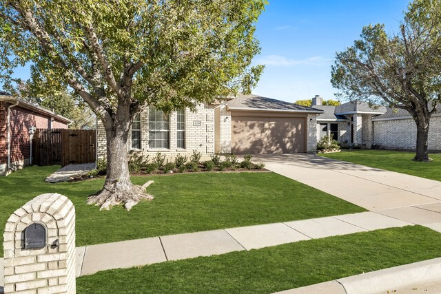 view of front facade with a front lawn and a garage