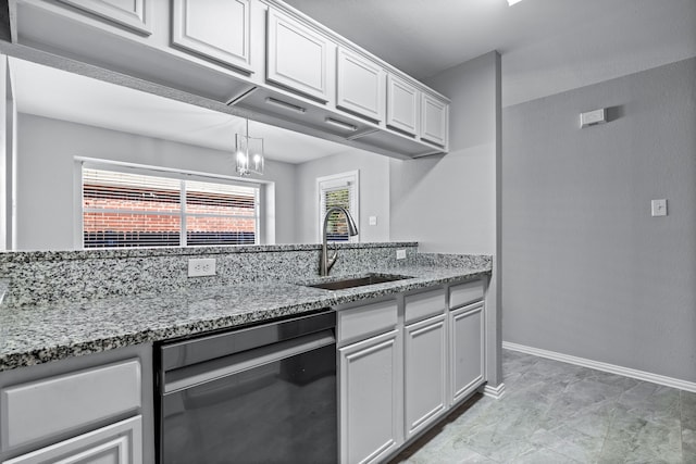 kitchen featuring white cabinetry, sink, and dishwasher