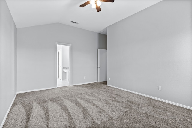 empty room featuring carpet floors, ceiling fan, and lofted ceiling