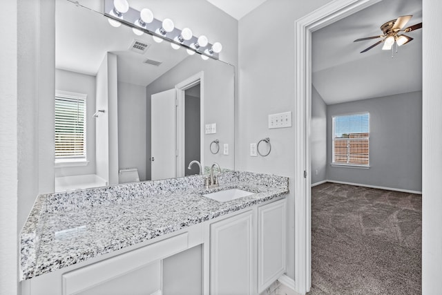 bathroom featuring ceiling fan, vanity, and toilet