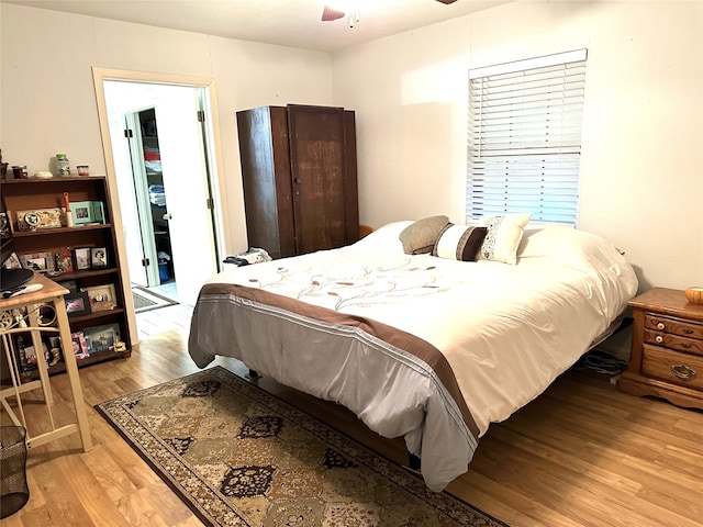 bedroom featuring light hardwood / wood-style flooring and ceiling fan