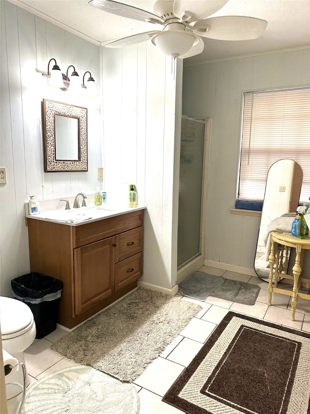 bathroom with an enclosed shower, a textured ceiling, vanity, ceiling fan, and tile patterned flooring