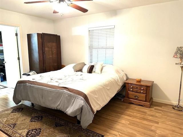 bedroom featuring ceiling fan and light hardwood / wood-style floors