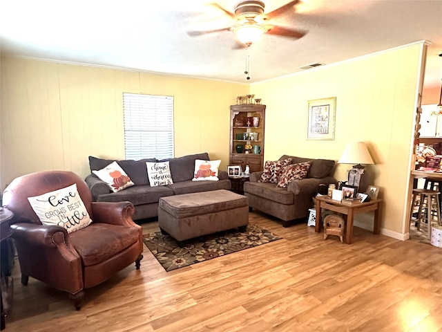 living room featuring ceiling fan and wood-type flooring