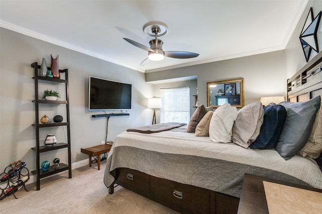 bedroom with light carpet, ceiling fan, and crown molding