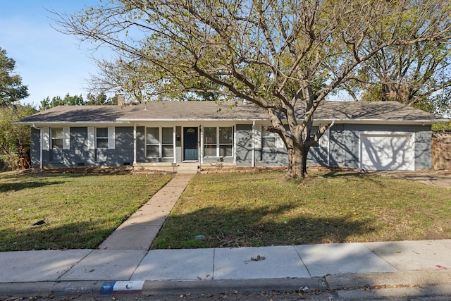 ranch-style house featuring a garage and a front lawn