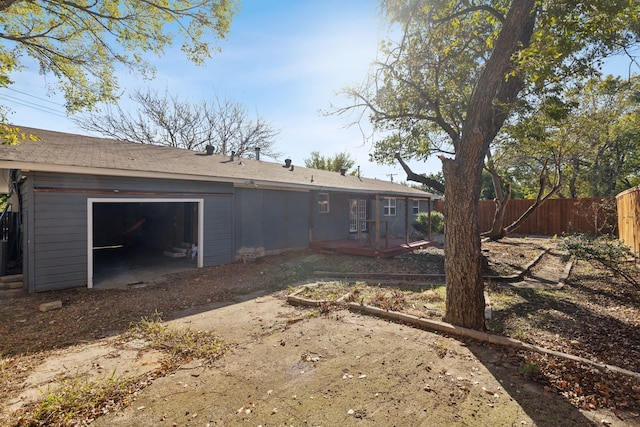 rear view of property with a wooden deck