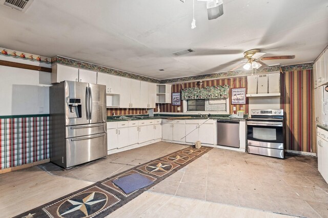 kitchen with white cabinets, stainless steel appliances, and ceiling fan