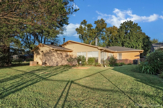 back of house with a yard