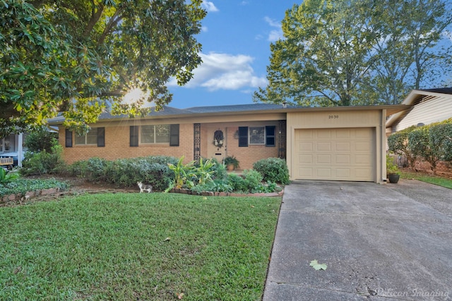 ranch-style home with a garage and a front lawn