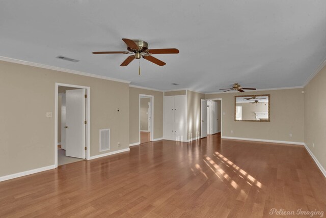 unfurnished living room with crown molding, ceiling fan, and light hardwood / wood-style floors