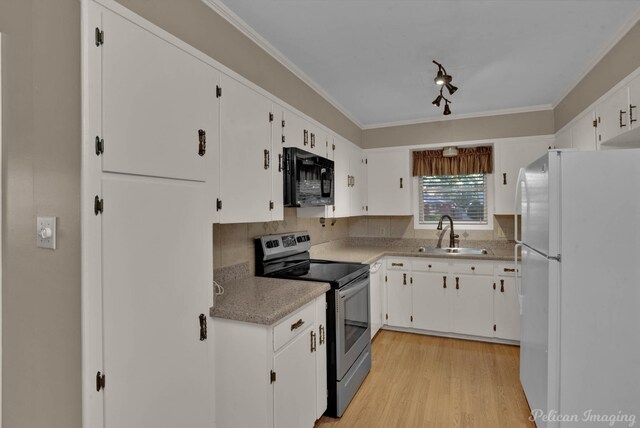 kitchen with white cabinetry, electric range, sink, crown molding, and white fridge