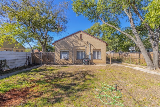 back of house with a yard