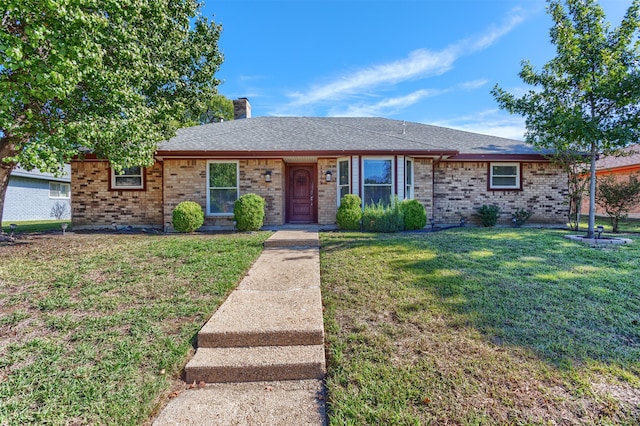 single story home featuring a front yard