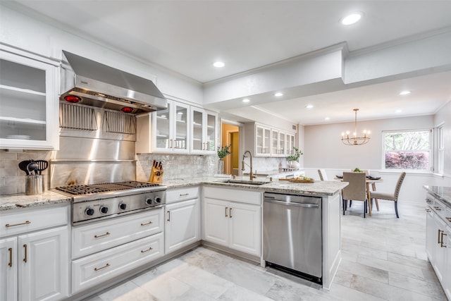 kitchen featuring white cabinetry, sink, wall chimney exhaust hood, backsplash, and stainless steel appliances