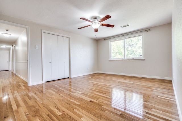 unfurnished bedroom featuring light hardwood / wood-style flooring and ceiling fan