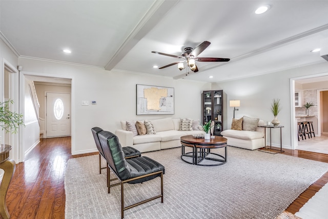 living room with ceiling fan, hardwood / wood-style floors, and ornamental molding