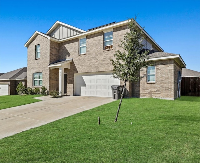 view of front of property featuring a garage and a front lawn