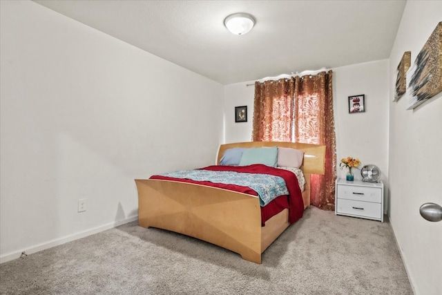 bedroom with light colored carpet