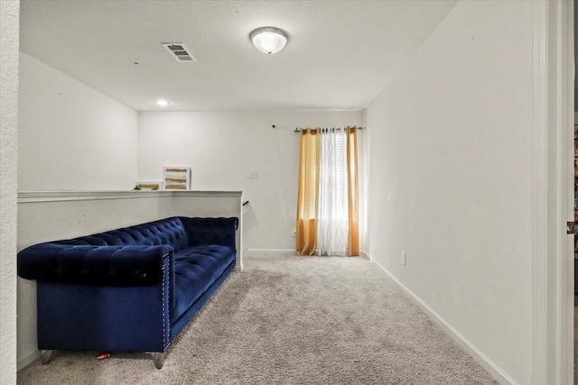 sitting room with carpet flooring