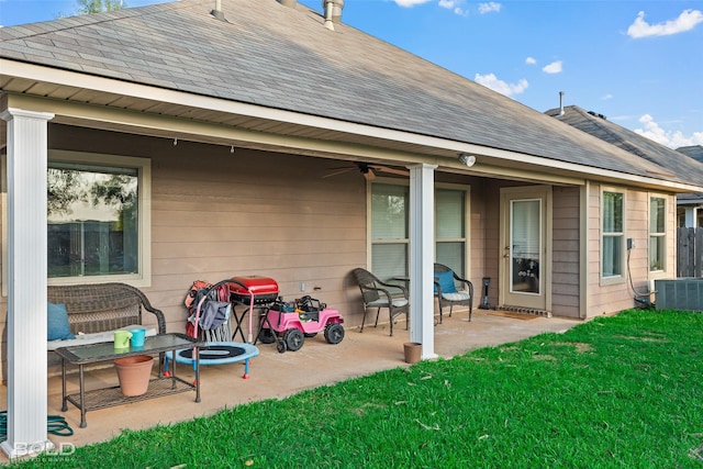 rear view of house featuring a yard, central AC unit, a patio, and ceiling fan