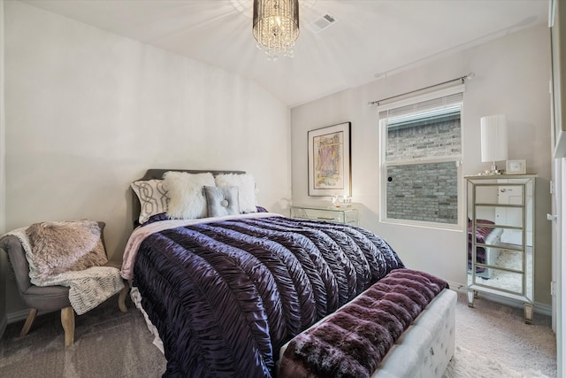 bedroom with an inviting chandelier, lofted ceiling, and carpet floors