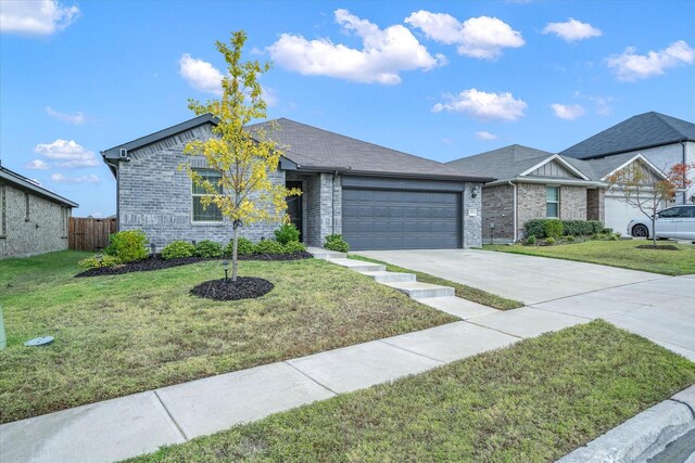 ranch-style house featuring a front yard and a garage