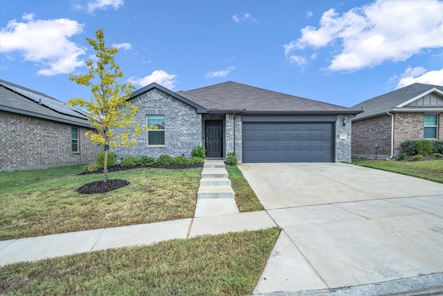 single story home with a garage and a front lawn