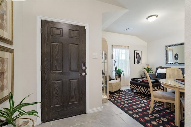 foyer entrance with light tile patterned flooring