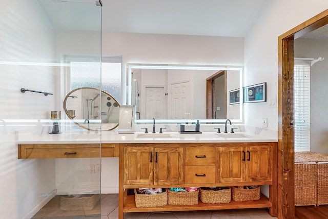 bathroom with tile patterned flooring and vanity