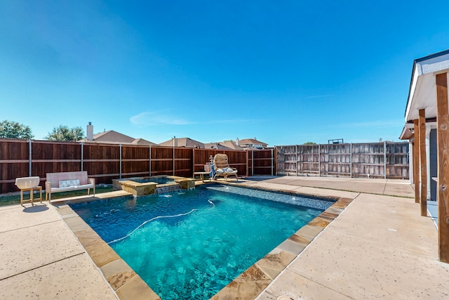 view of pool with an in ground hot tub, a patio, and an outdoor living space