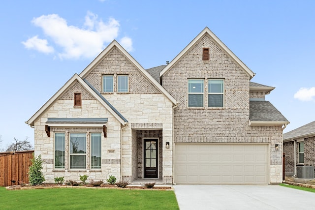 craftsman house featuring a garage, central AC, and a front yard