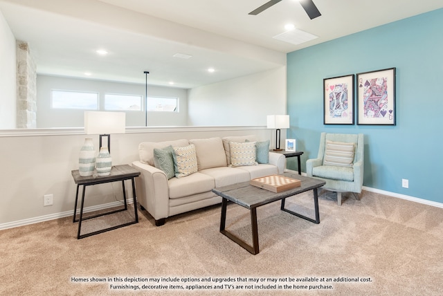 living room featuring ceiling fan and light colored carpet