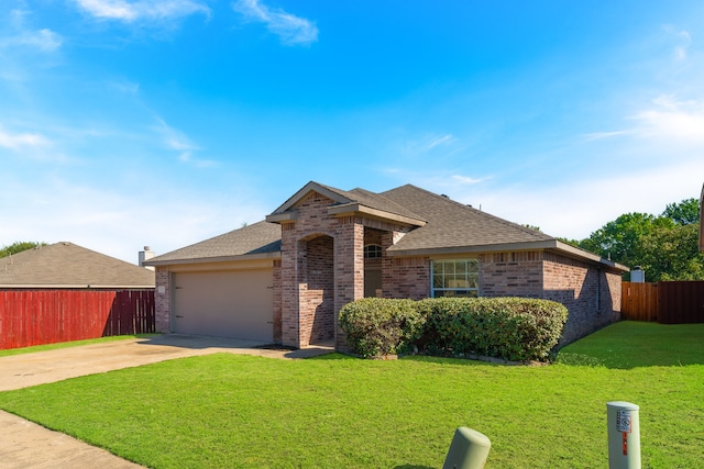 ranch-style house with a front yard and a garage