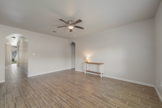 empty room featuring light wood-type flooring and ceiling fan