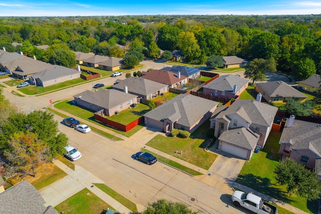 ranch-style house with a garage and a front lawn