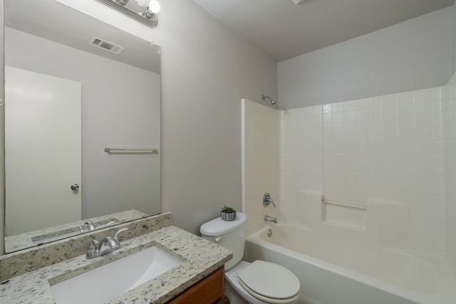 full bathroom with vanity, toilet, and washtub / shower combination