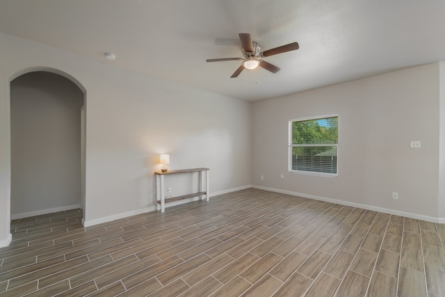 empty room featuring ceiling fan and light wood-type flooring