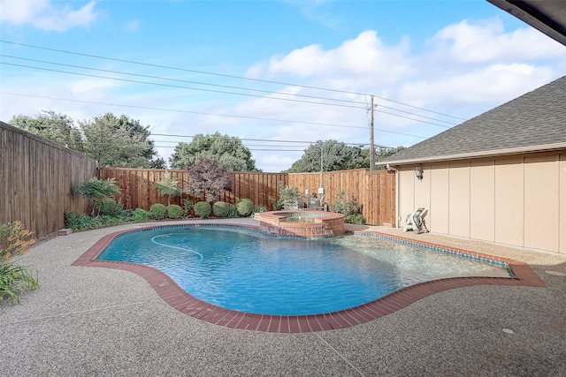 view of pool with an in ground hot tub