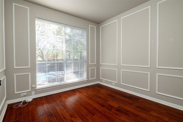 empty room featuring hardwood / wood-style floors