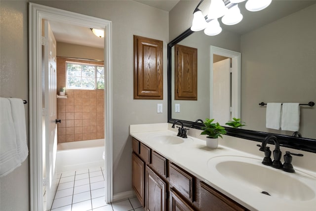 bathroom with vanity, tile patterned floors, and a bathtub