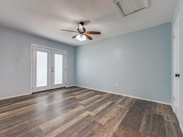 unfurnished room with ceiling fan, dark hardwood / wood-style flooring, and french doors