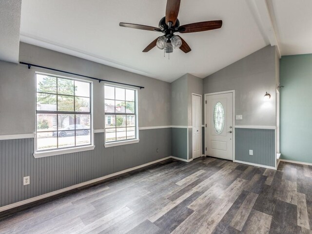 foyer entrance with lofted ceiling with beams, dark hardwood / wood-style floors, plenty of natural light, and ceiling fan