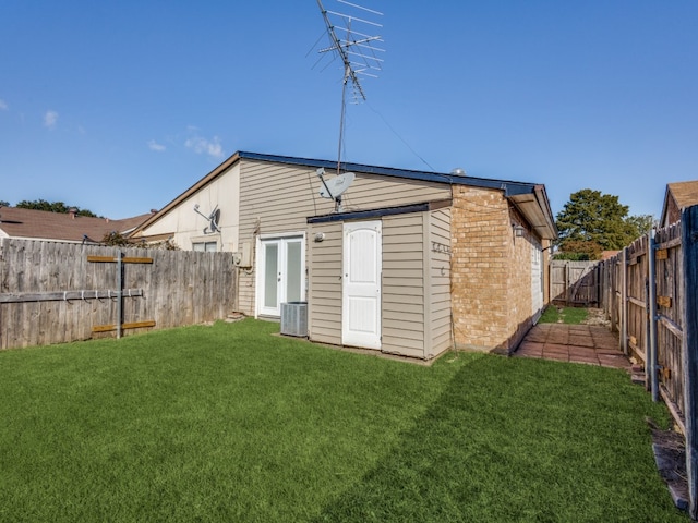 view of outbuilding with a lawn